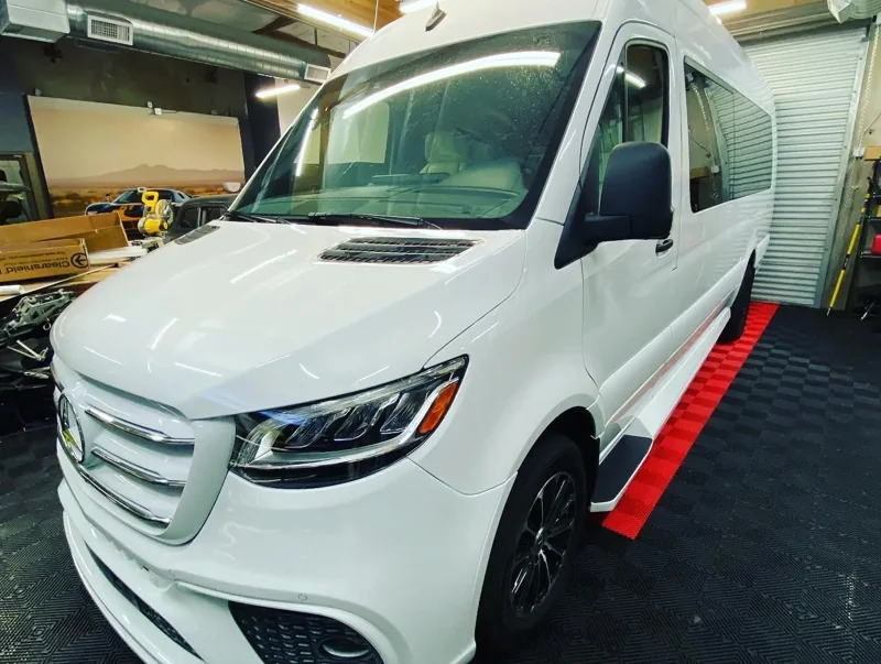 White Mercedes Sprinter van inside the Vader Tint shop